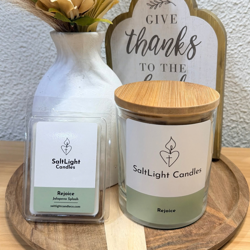 Rejoice | Jalapeño Splash candle from SaltLight Candles. Photo of the candle, melt, vase, and plant. 