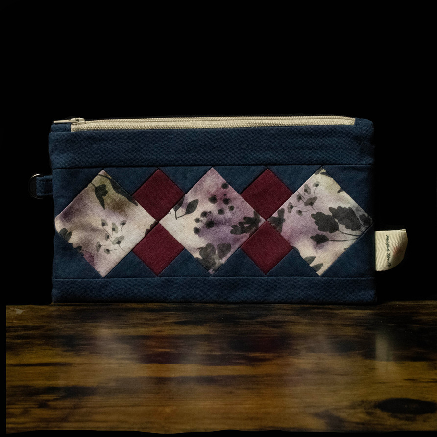 phat girlz fibre berry and vine quilted pouch stock photo