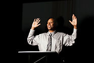 Speaker with Hands Raised