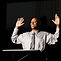 Speaker with Hands Raised