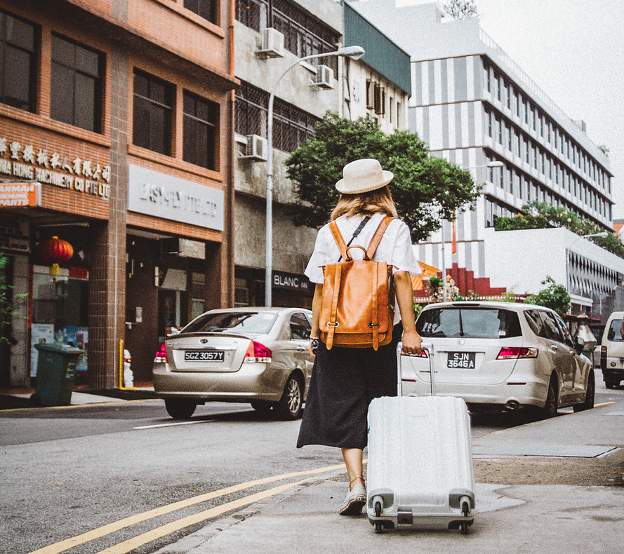 Woman Dragging Suitcase