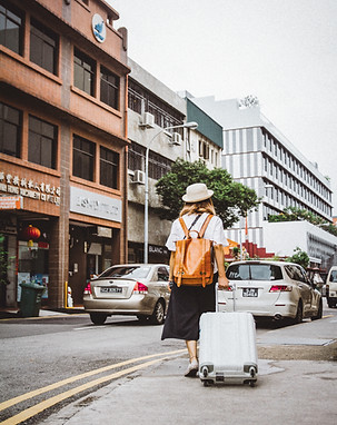 Woman Dragging Suitcase