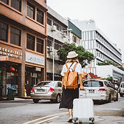Woman Dragging Suitcase