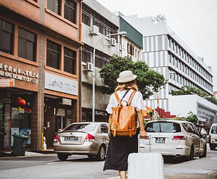 Woman Dragging Suitcase