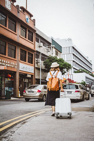 Woman Dragging Suitcase