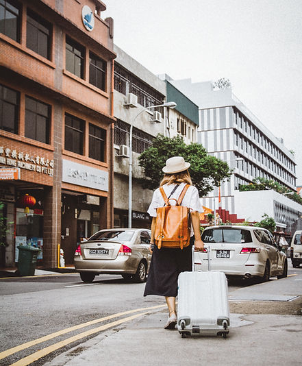 Woman Dragging Suitcase