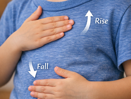 A child’s chest rising and falling during breathing exercise.