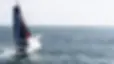 IMOCA racing yacht battling waves during the Vendée Globe