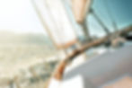 Sailboat sailing on a reach with wind data displayed on chartplotter