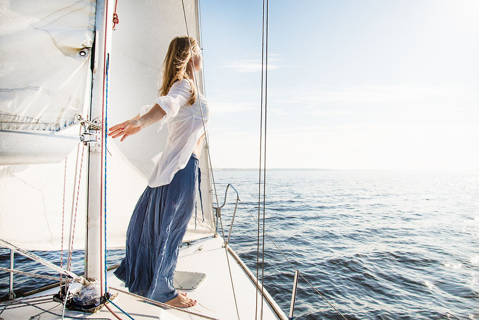 Sailor enjoying morning coffee in the cockpit while living aboard