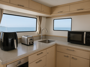 Yacht galley powered by inverter showing appliances at anchor