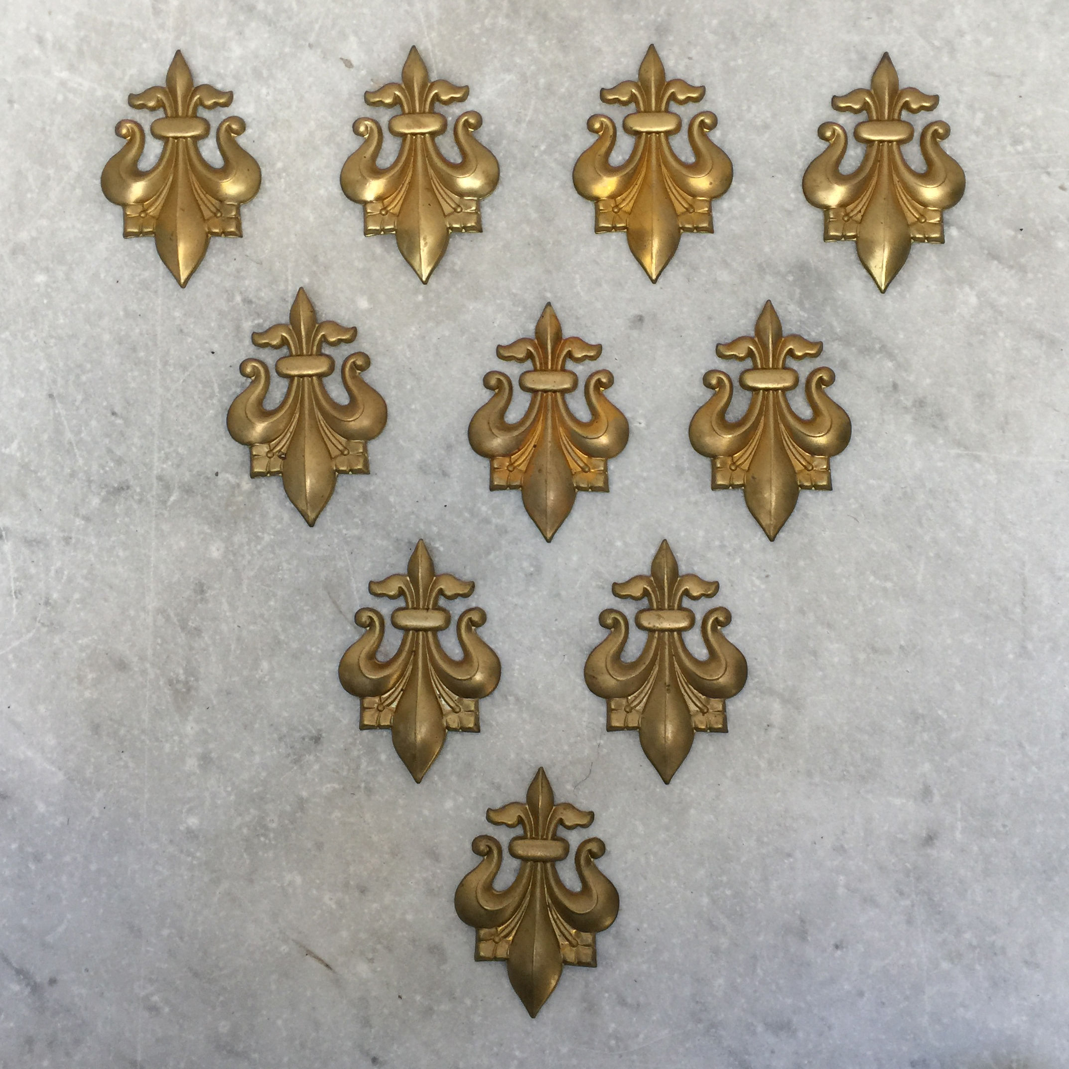 Set Of Ten Brass 'Fleur De Lis' Applique Mounts