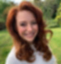 Smiling woman with auburn hair