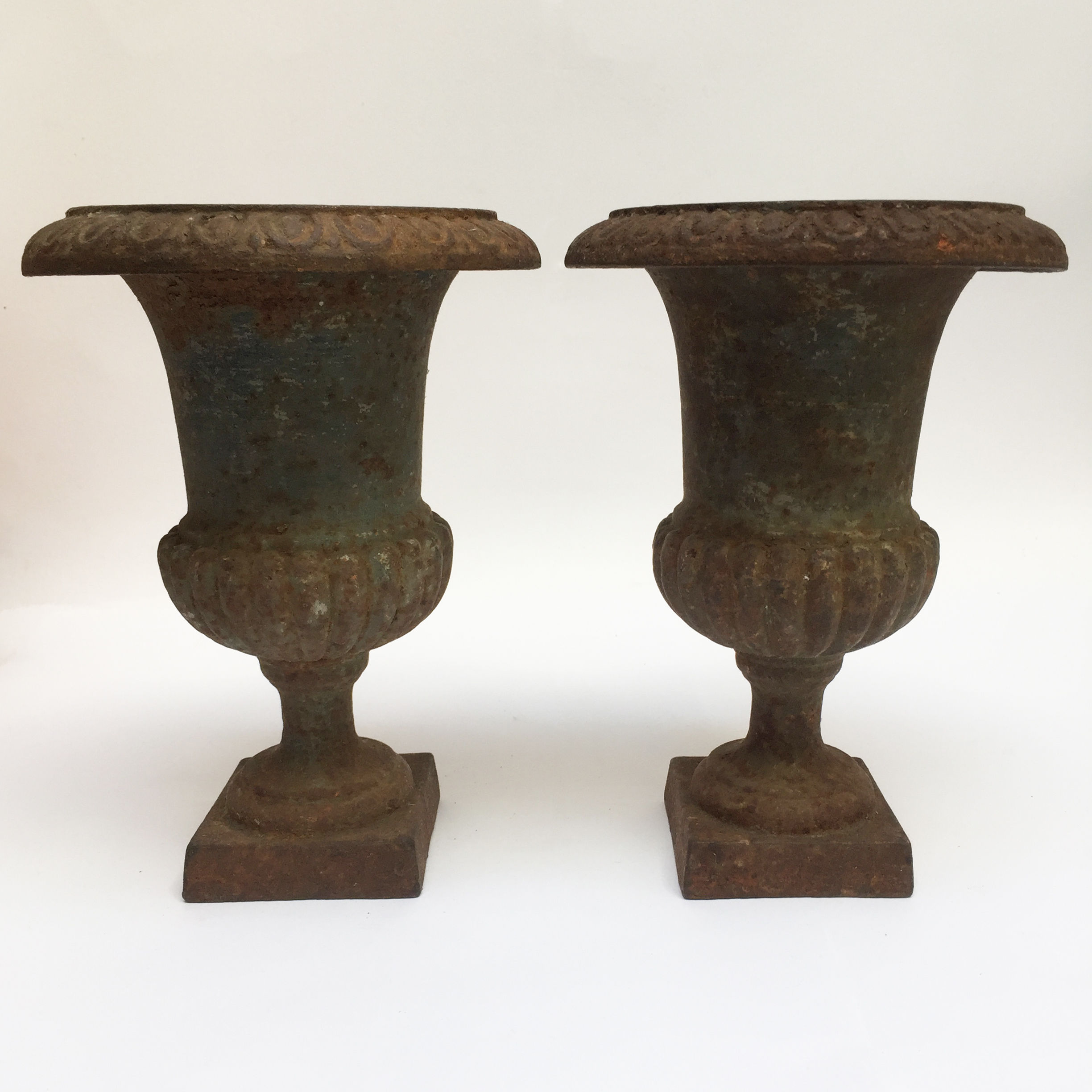 A Pair Of French Iron Urns