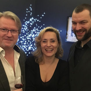 Three people smiling at a party