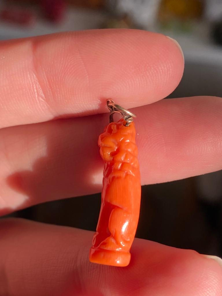 Thumbnail: Georigan Coral Lion Carved From Skinny Coral Branch