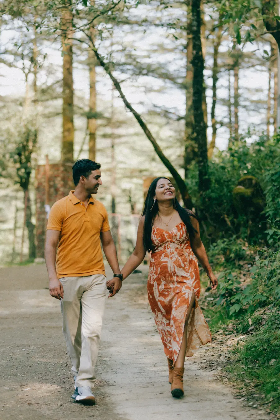 candid pre wedding shoot mussoorie couple walking on forest road natural moments