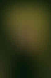 Couple sharing a candid moment near ivy-covered walls during Mussoorie pre wedding photoshoot.