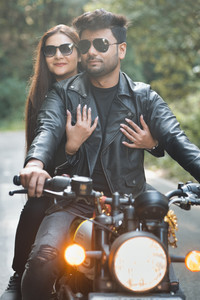 Adventurous pre-wedding bike shoot on Chamba–Tehri road with couple in black leather jackets and sunglasses