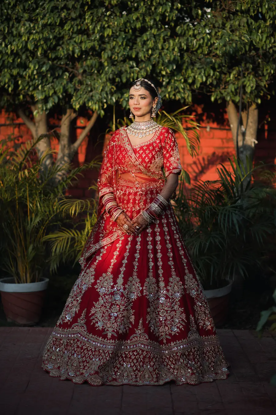The bride is all set for her wedding day, emotions captured perfectly while she poses.