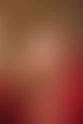 Stunning bride in red lehenga and traditional jewelry, photographed at The Solitaire Hotel, Dehradun.