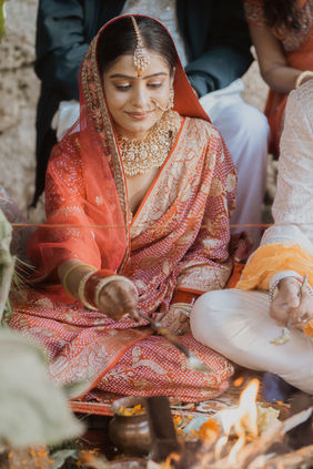 Indian  bride sitting near sacred fire during Triyuginarayan Temple wedding