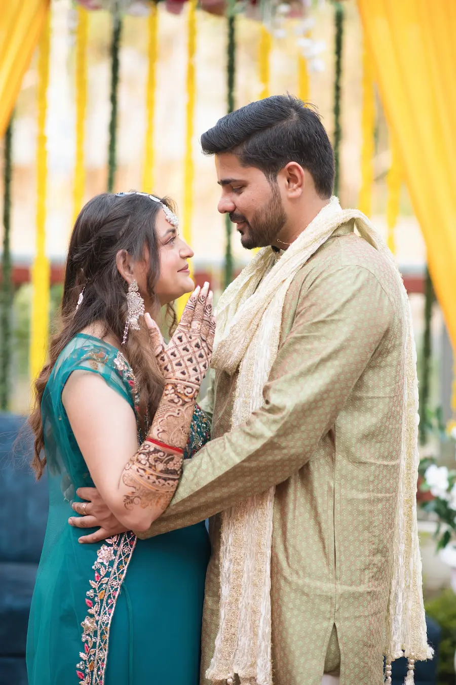 A candid moment during a traditional haldi function, capturing the warmth and simplicity of a mountain celebration in Uttarakhand.