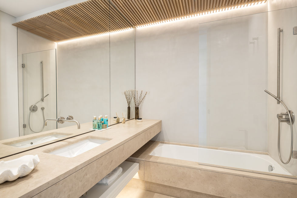 a bathroom with two sinks and a bathtub