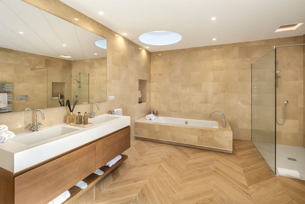 Master Bathroom: The sumptuous master bathroom featuring high-end fixtures and a soaking tub.