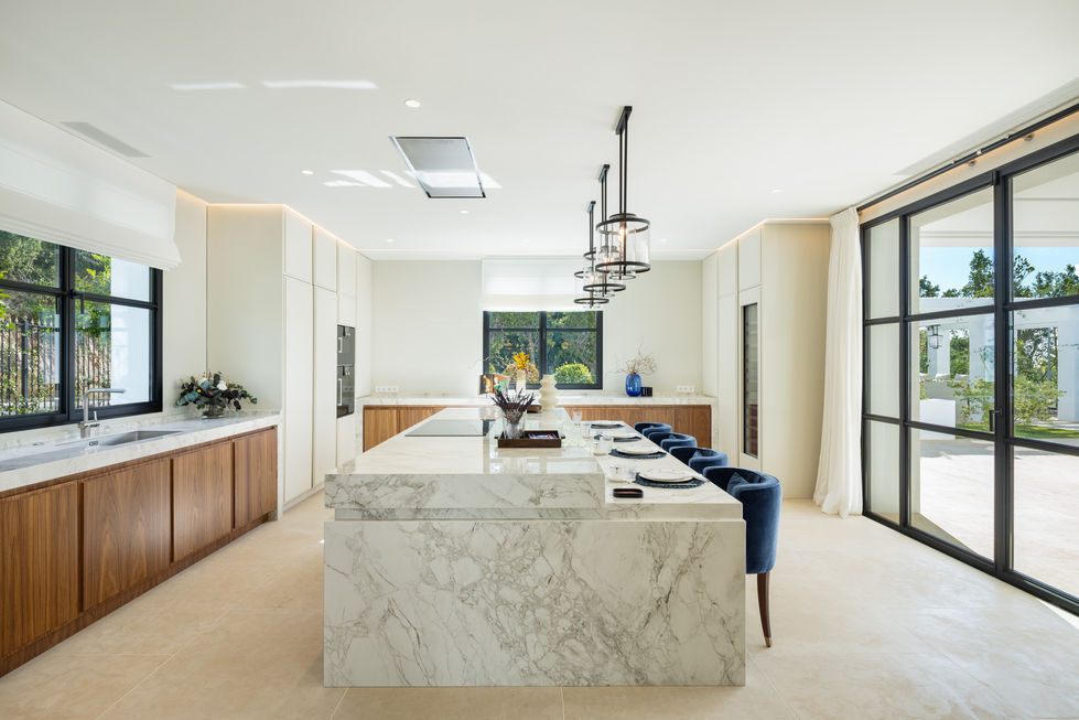 a kitchen with a large marble counter top