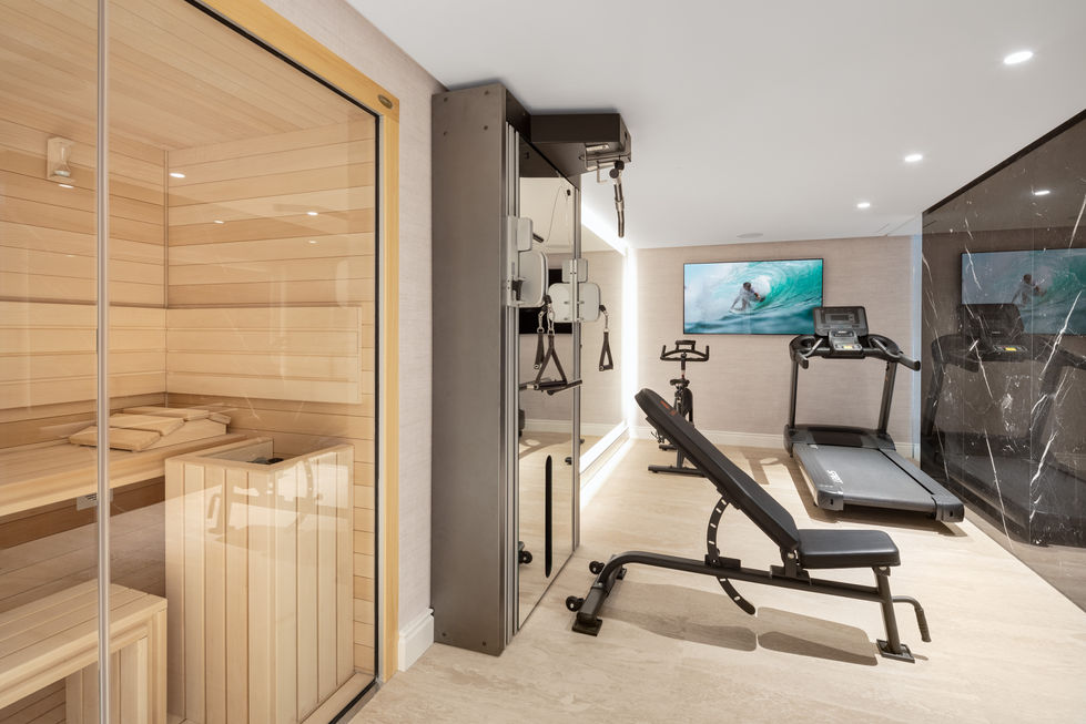 a gym with a treadmill and a bike