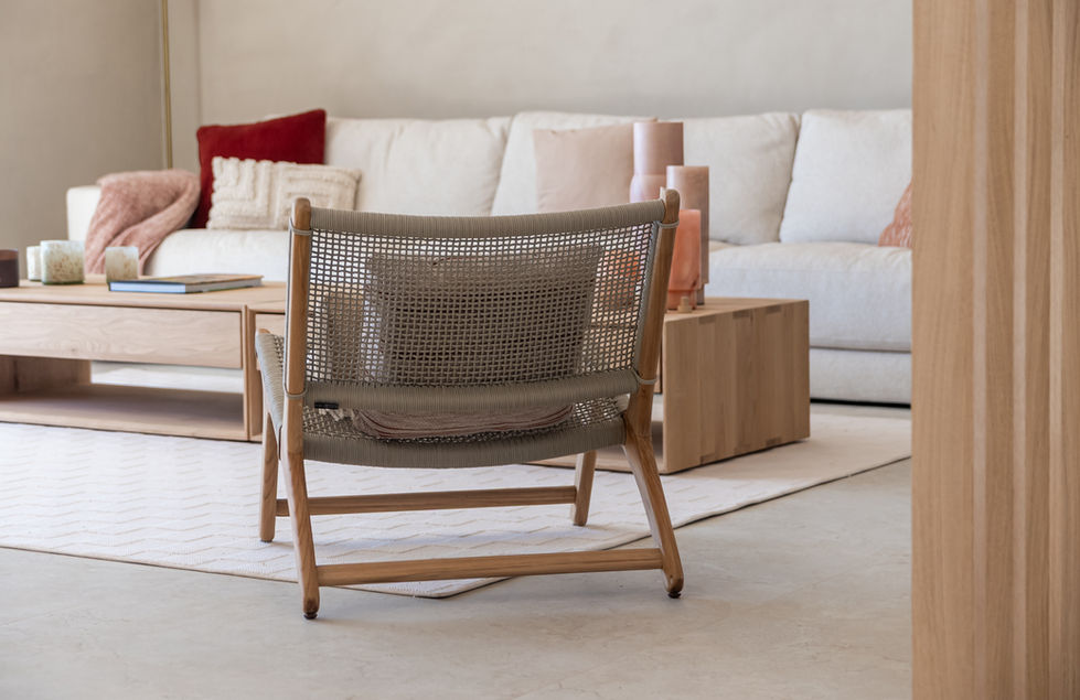 Relaxing lounge setup on the master bedroom balcony with sea views.