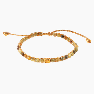 Beaded bracelet with varied earthy tones and a central square bead.