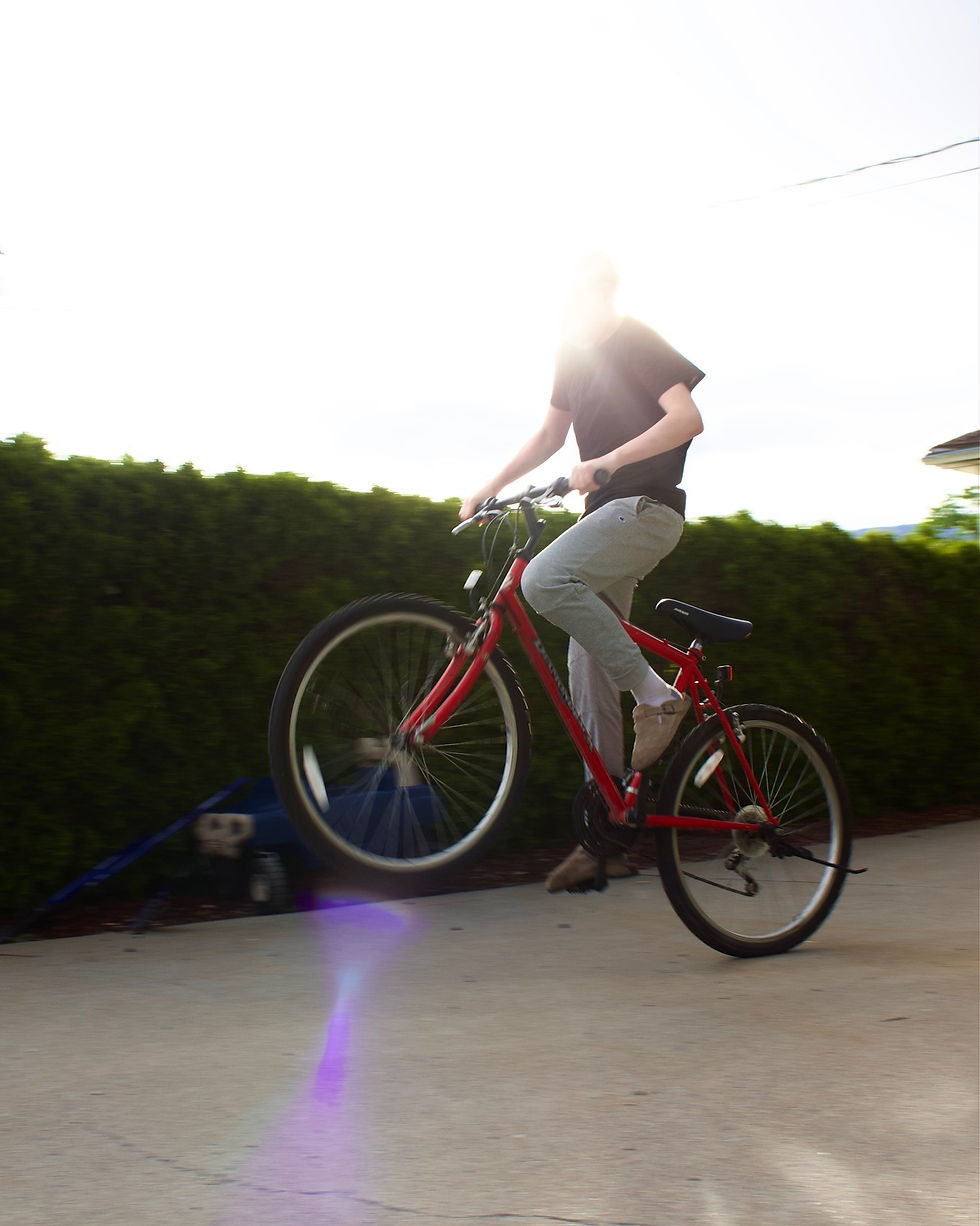 I used movement in the frame to appear more life-like and interesting. I used line with the sun light to draw the eye to the bike rider.
