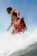 A man holding a DELSEY PARIS backpack.