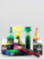 Bottles of colorful acrylic ink and markers arranged on a gray background, featuring labels with "ACRYLIC INK" text.