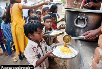 Children receiving food from a pot, rice and eggs visible, Punorutthan welfare society NGO.