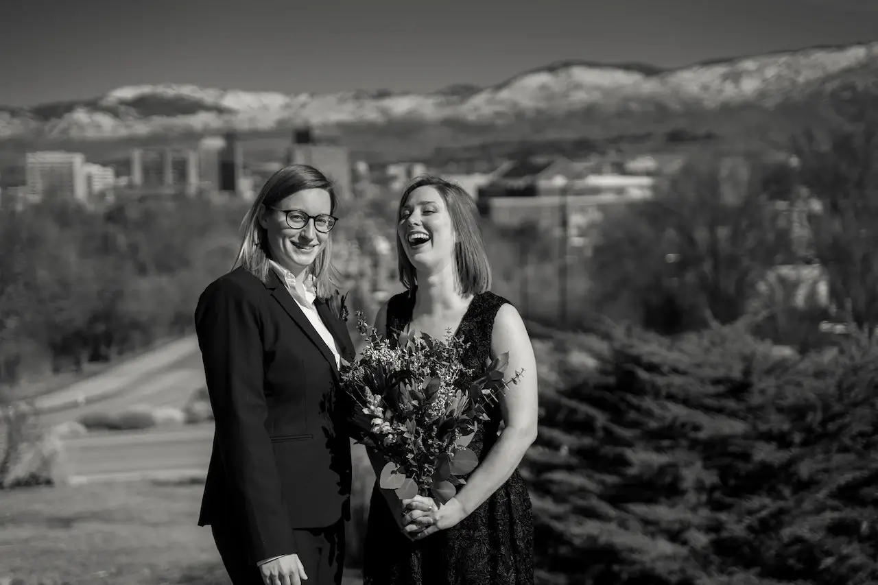 two young women same sex couple smiling