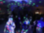 people dancing on music with dj lights