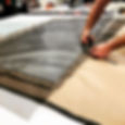 Cutting a fabric in a workshop for upholstery