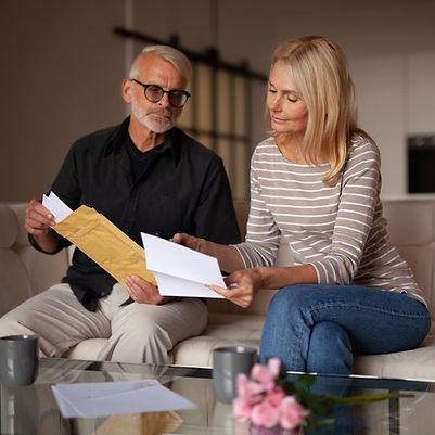 An old woman showing a document to her husband