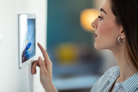 Lady setting up automation security for her home
