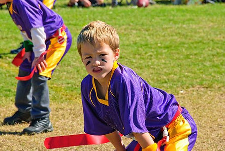Boy playing sports with an athletic mouth guard