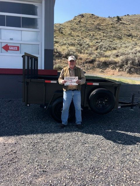 a view of a man with his trailer