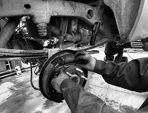 Rommel working on car brake