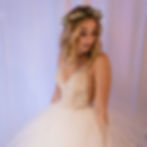 Young woman in white dress with styled hair