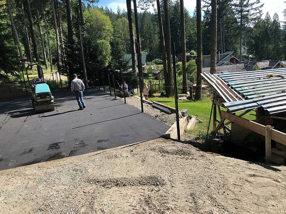 man waking on asphalt road