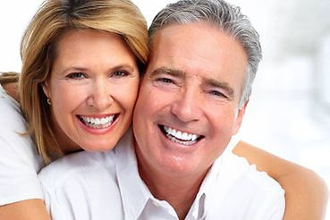Portrait of a young woman with a perfect smile in the dental office.
