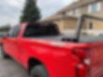 Red truck with black rack