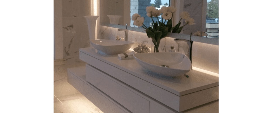 floating vanity counter with double sink and flowers in bathroom